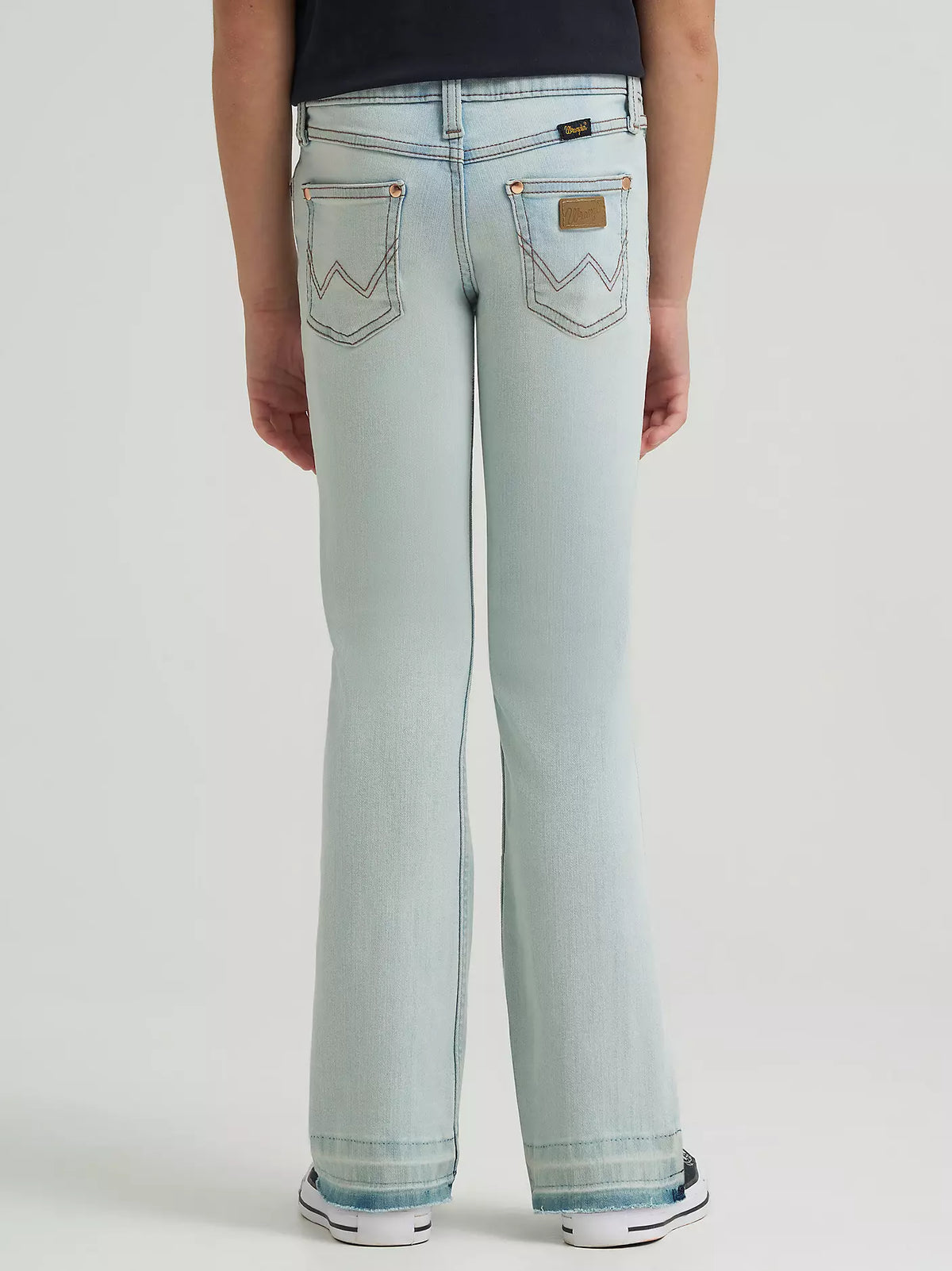 Wrangler x Lainey Wilson Girl's Raw Hem Boot Hugger Jean in Bleach Blue Wash