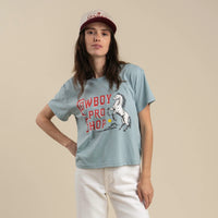 Sendero Provisions Co. Women's Cowboy Pro Shop Cropped T-Shirt in Sterling Blue