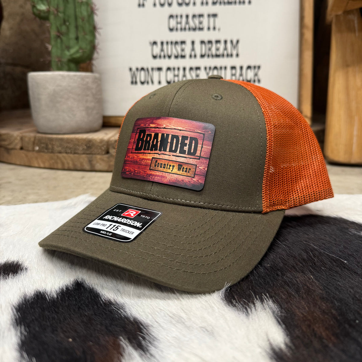 Branded Country Wear Leather Logo Patch 6 Panel Trucker Hat in Olive & Orange