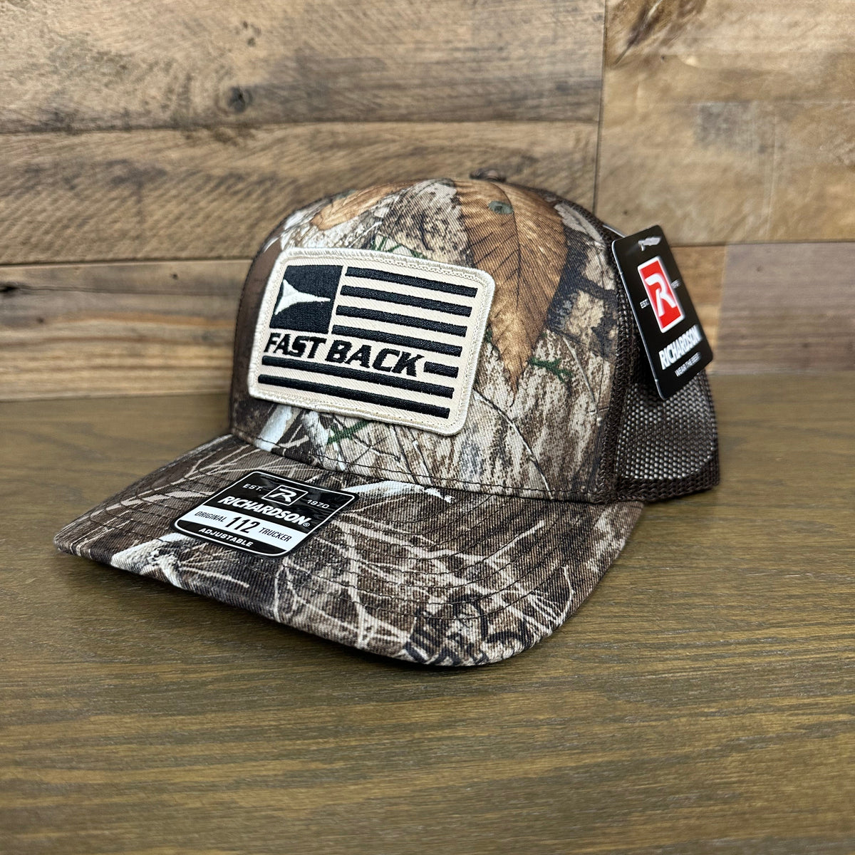 Fast Back Ropes Men's Flag Patch Trucker Cap in Realtree